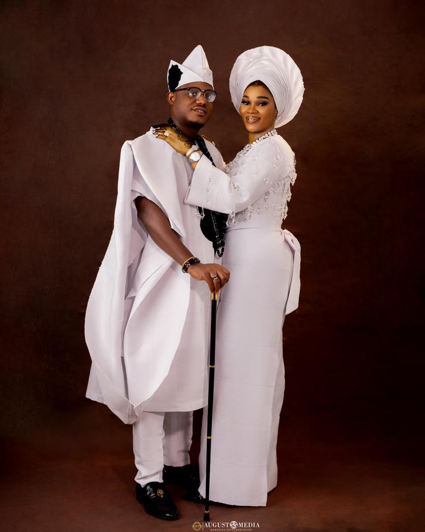 Custom traditional white agbada and asoebi for couple